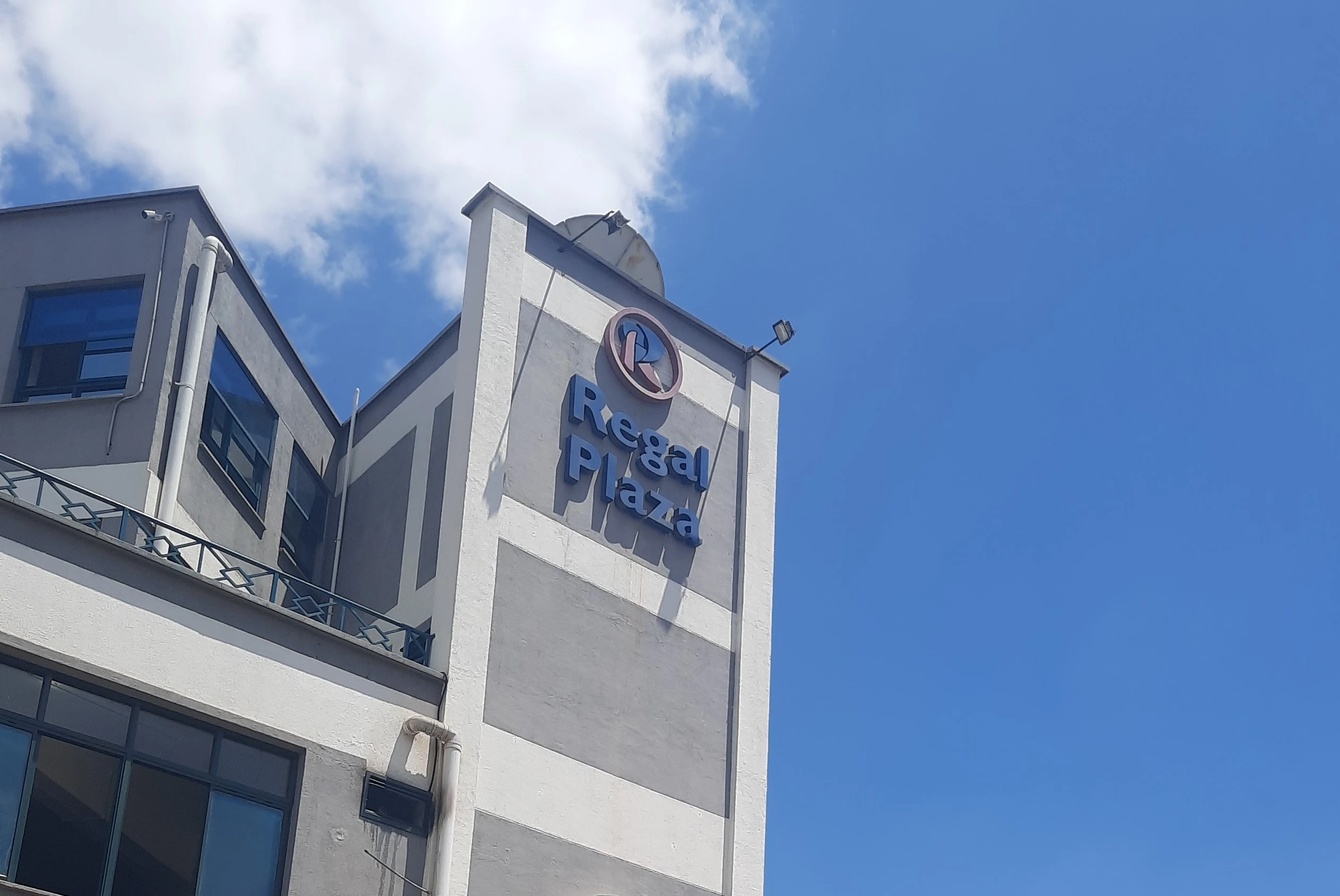 Regal Plaza Ad with Us